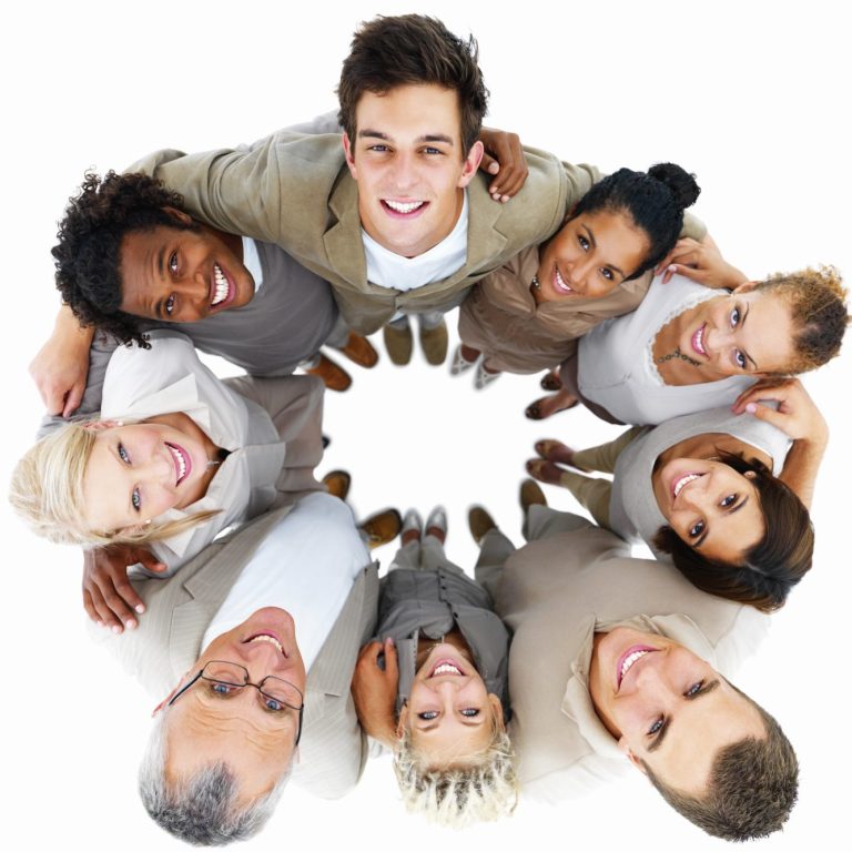 Photo: group of eight happy people in a circle, looking upwards at camera